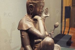 religious statue with many hands in tokyo