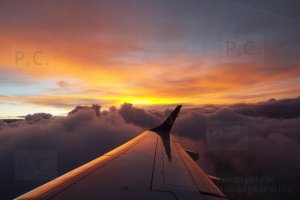 light orgy in flight over clouds sunrise