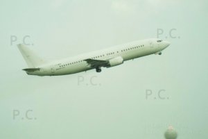 b 737 ly-mgc takes off in rain from chopin airport 23. 05. 2019.JPG