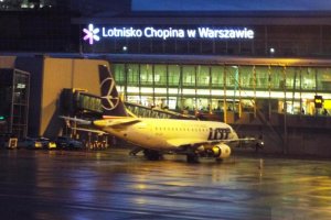 warsaw at night chopin airport embraer jet november 2019.JPG