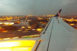 warsaw blurred lights jet plane landing at chopin sp-lnm.JPG