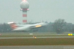 hardly visible zooming aircraft early morning.JPG