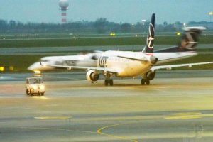 lot polish airlines bombardier embraer early morning chopin flight operations.JPG