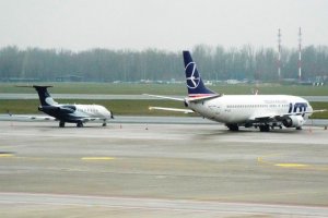 small and big jet warsaw poland chopin airport.JPG