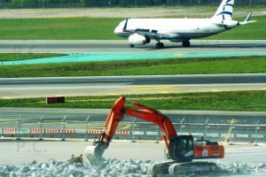 hitachi backhoe and airbus jet chopin airport.JPG