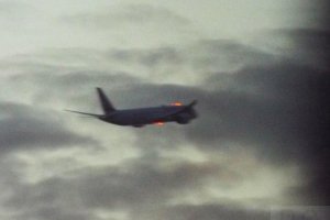 warsaw evening clouds jet aircraft red lights.JPG