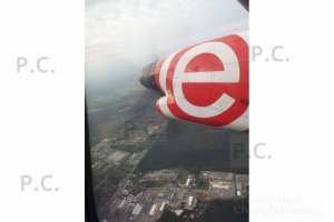 q 400 banking over polish landscape